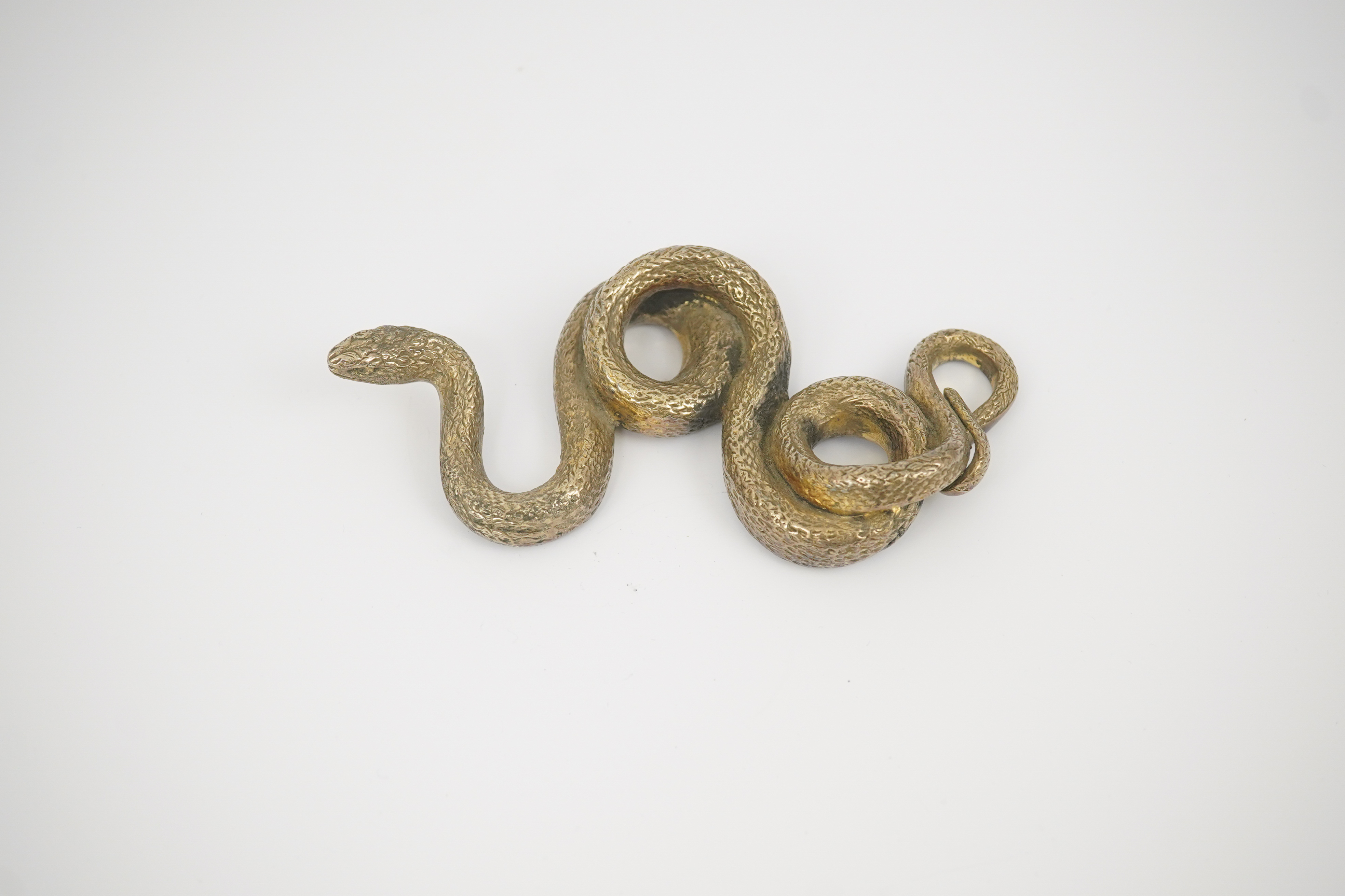 A Sterling silver gilt model of a snake, stamped PR.S